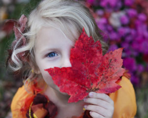 little girl with leaf